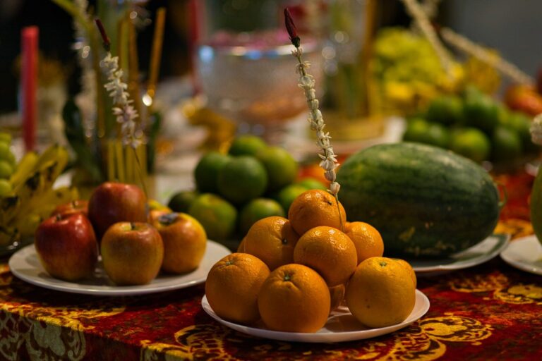 orange fruits on white ceramic plate