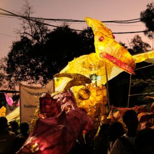 a large group of people standing around a float