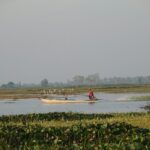 A person in a boat in a body of water