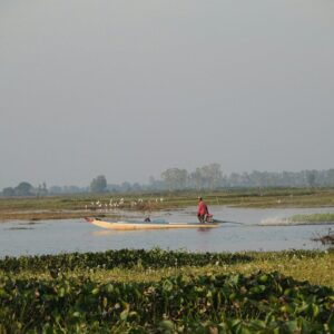 A person in a boat in a body of water