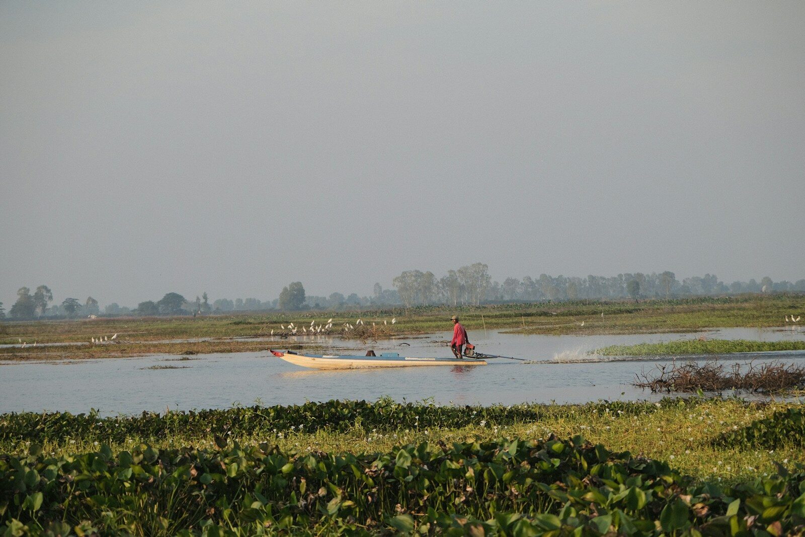 A person in a boat in a body of water